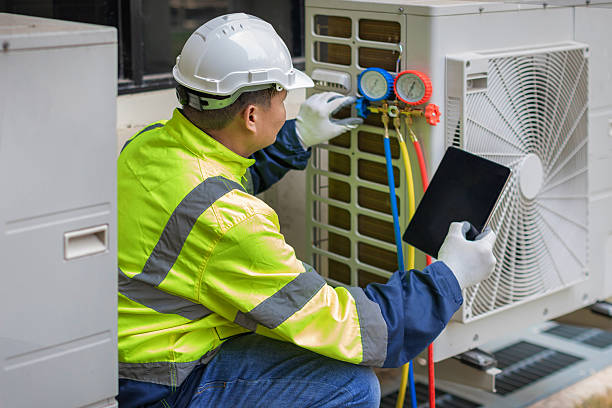 Professional Air Conditioning Repair technician working in Leonard, MI